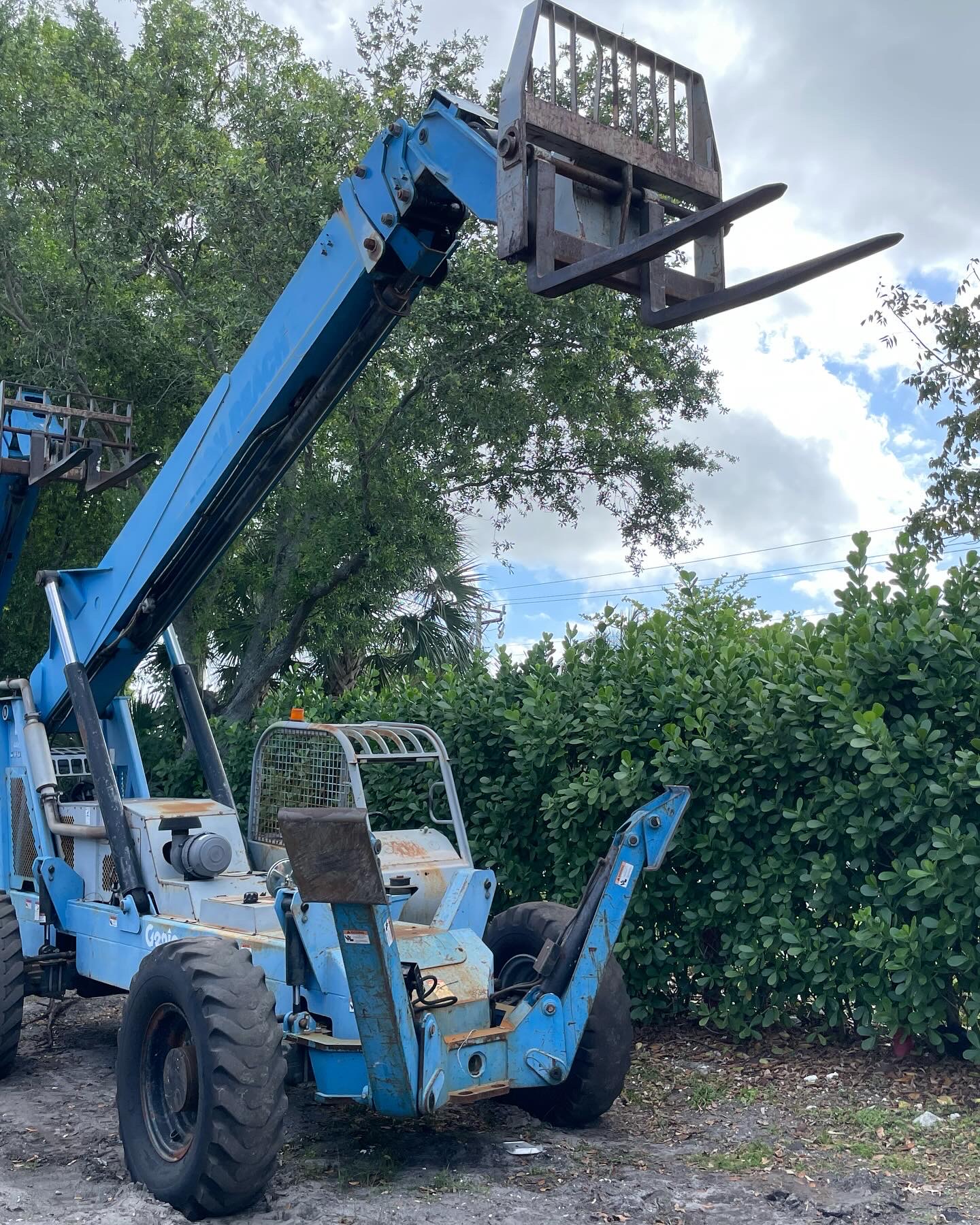 Blue Genie telehandler with raised boom